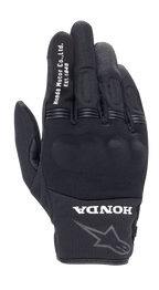 Guanto Alpinestars Honda Copper, guanto da moto urban nero, struttura in mesh testurizzato, scritta bianca 'Honda Motor Co. Ltd. Est. 1948' sull'indice, logo 'HONDA' e profilo della stella Alpinestars sul polso, protezione rigida per le nocche, equipaggiamento leggero per la guida su strada
