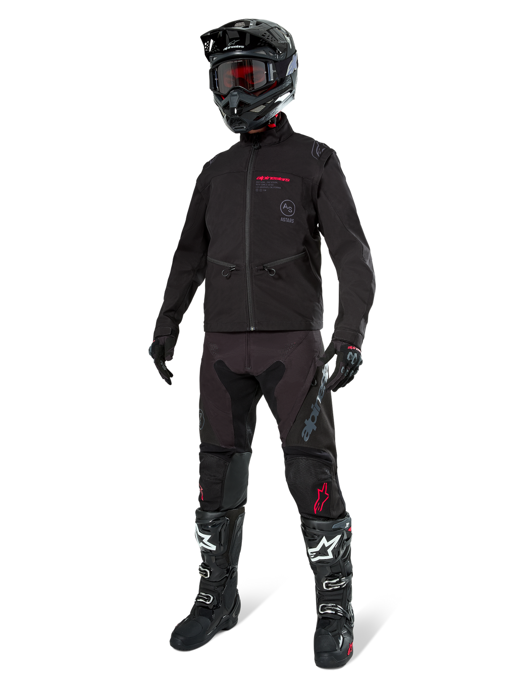 Alpinestars Lite-Dura Softshell Jacket, nero, indossata da un manichino come parte di un completo da fuoristrada, pantaloni neri, stivali neri e bianchi, casco nero con occhiali rossi, abbigliamento professionale da motocross ed enduro.