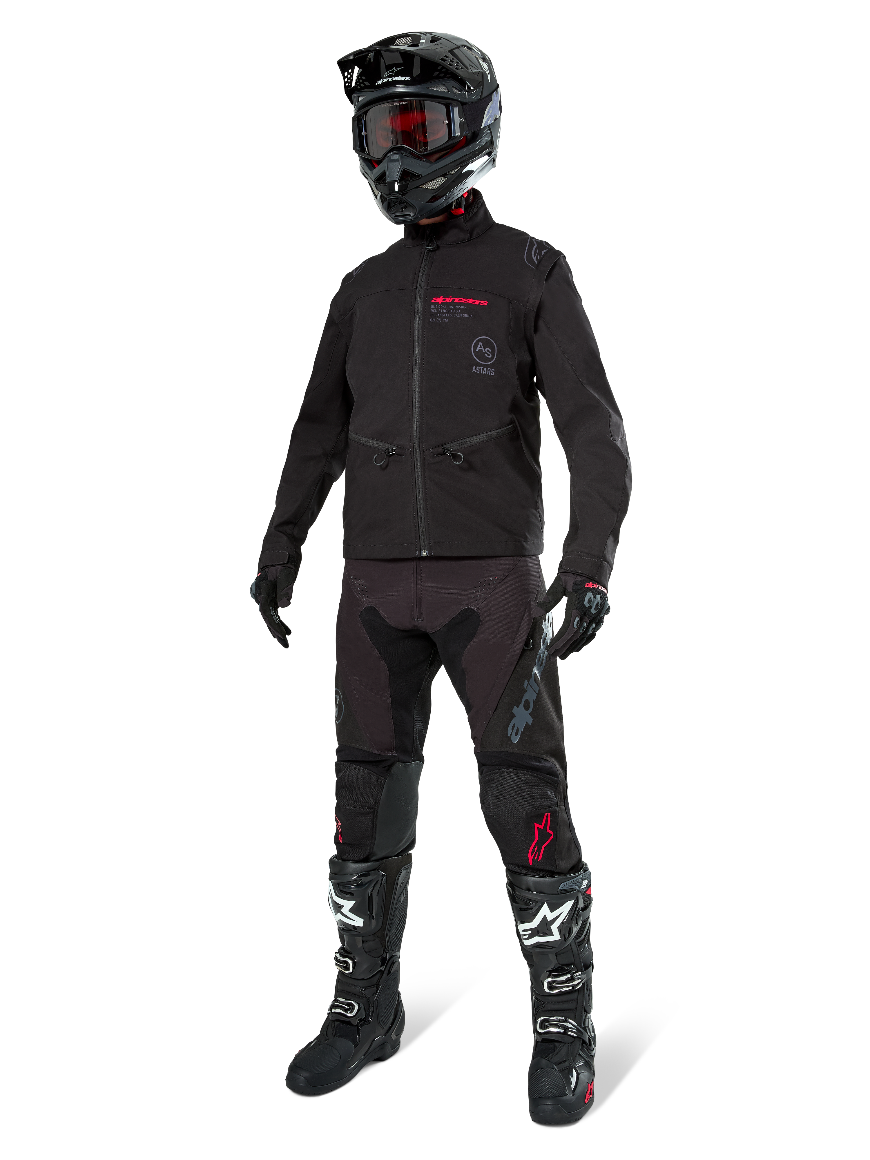 Alpinestars Lite-Dura Softshell Jacket, nero, indossata da un manichino come parte di un completo da fuoristrada, pantaloni neri, stivali neri e bianchi, casco nero con occhiali rossi, abbigliamento professionale da motocross ed enduro.