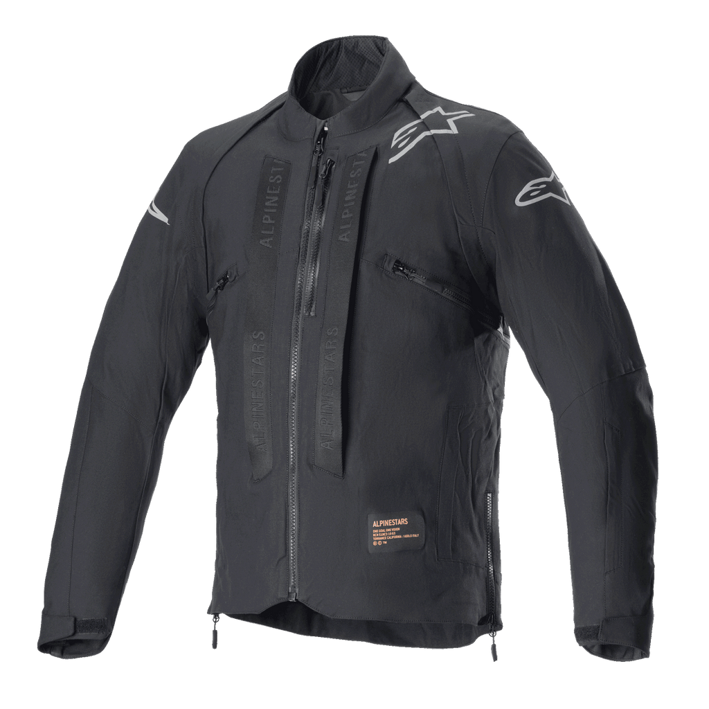 Giacca Alpinestars Techdura, giacca da moto off-road Black Reflex, con loghi a stella bianchi sulle spalle, marchio Alpinestars tono su tono sui pannelli del petto, zip frontale e costruzione in tessuto resistente, design tecnico da enduro.