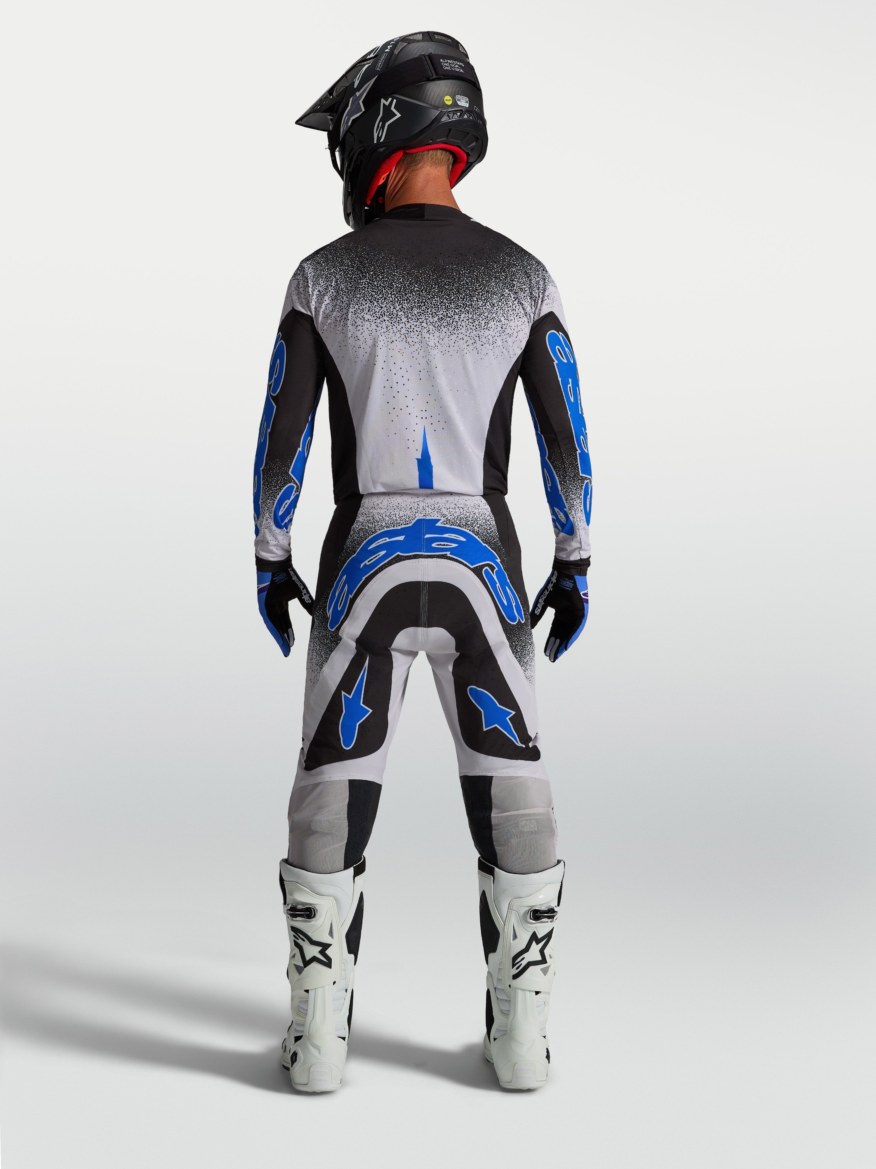 Alpinestars Pantaloni Supertech Hiten AFD, pantaloni da motocross da uomo, blu e bianchi, vista posteriore fuoristrada