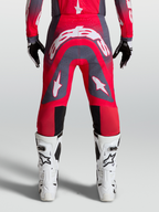 Alpinestars Pantaloni Supertech Hiten AFD, pantaloni da motocross professionali racing, rosso fluo e grigio con loghi bianchi, vestibilità atletica da gara.