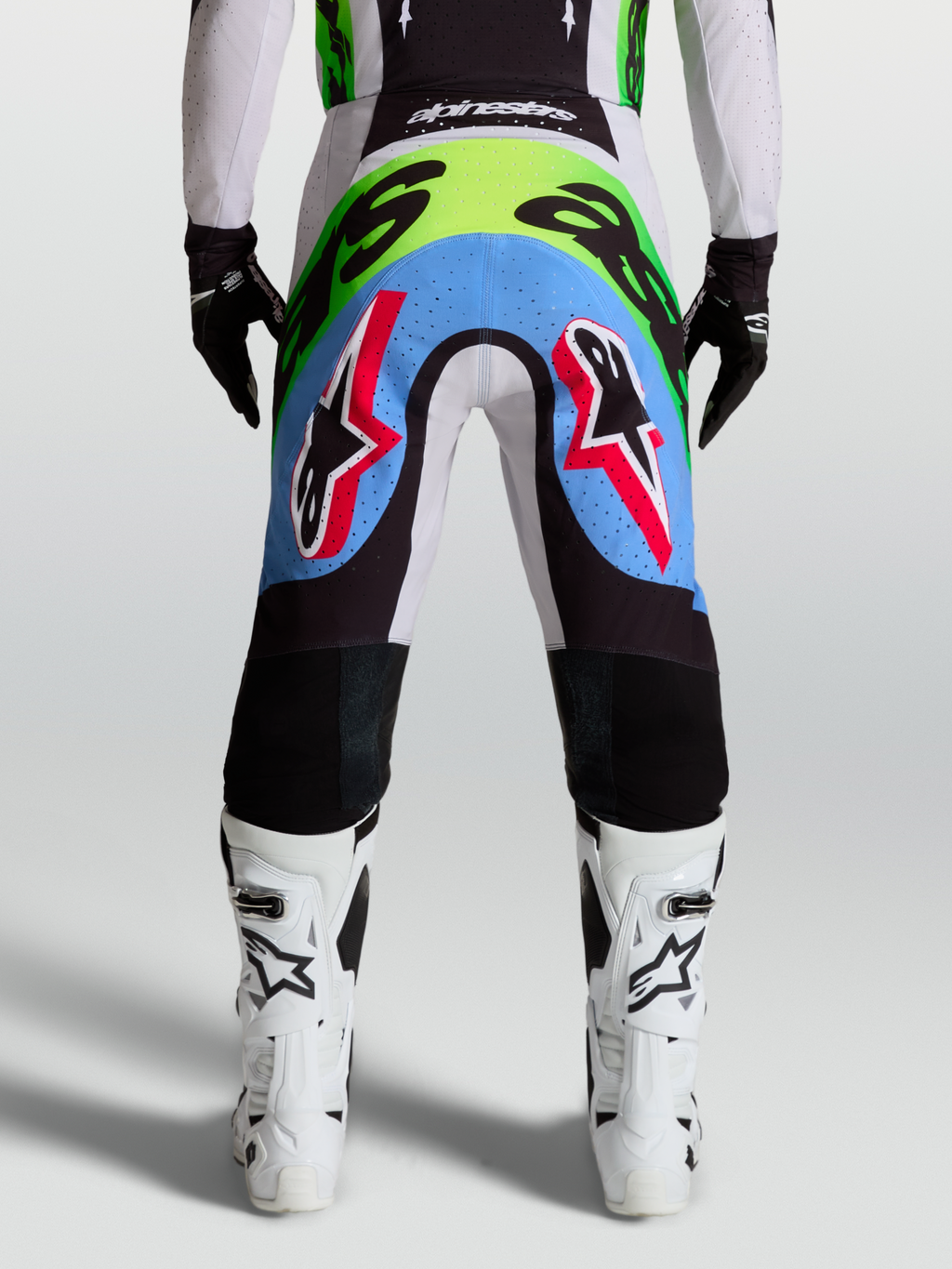 Alpinestars pantaloni Supertech Dyna, pantaloni da motocross da uomo, lilla chiaro e verde fluo, vista posteriore con pannelli elasticizzati traforati