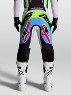 Alpinestars pantaloni Supertech Dyna, pantaloni da motocross da uomo, lilla chiaro e verde fluo, vista posteriore con pannelli elasticizzati traforati