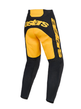 Alpinestars 2026 Racer Riway Pants, pantaloni da motocross, giallo e nero, vista posteriore con vistoso branding 'astars' giallo sulla seduta e sul fianco, parte inferiore delle gambe nera con pannelli in mesh e costruzione ergonomica pre-curvata per gare off-road.