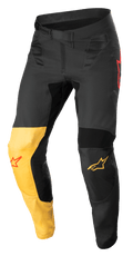 Alpinestars Supertech Blaze Pants, pantaloni da motocross, nero, giallo caldo e rosso fluo, con pannello giallo sul ginocchio, loghi stella rossi, chiusura a cricchetto in vita e pannelli protettivi rinforzati per prestazioni fuoristrada