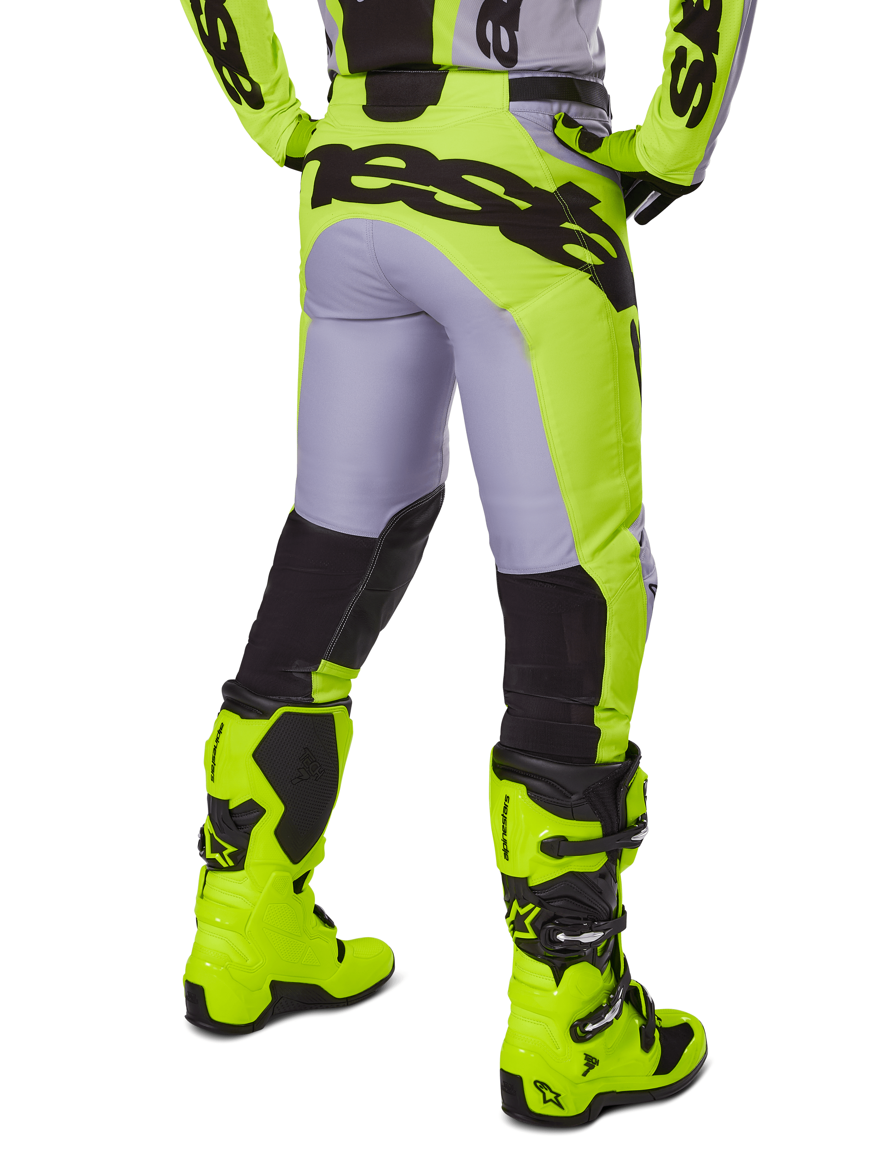 Alpinestars 2025 Racer Veil Pants, pantaloni da motocross, grigio e giallo fluo, vista posteriore che mostra la costruzione ergonomica con grande marchio nero sulla seduta, pannelli neri sulla parte inferiore della gamba e stivali da corsa giallo fluo abbinati.