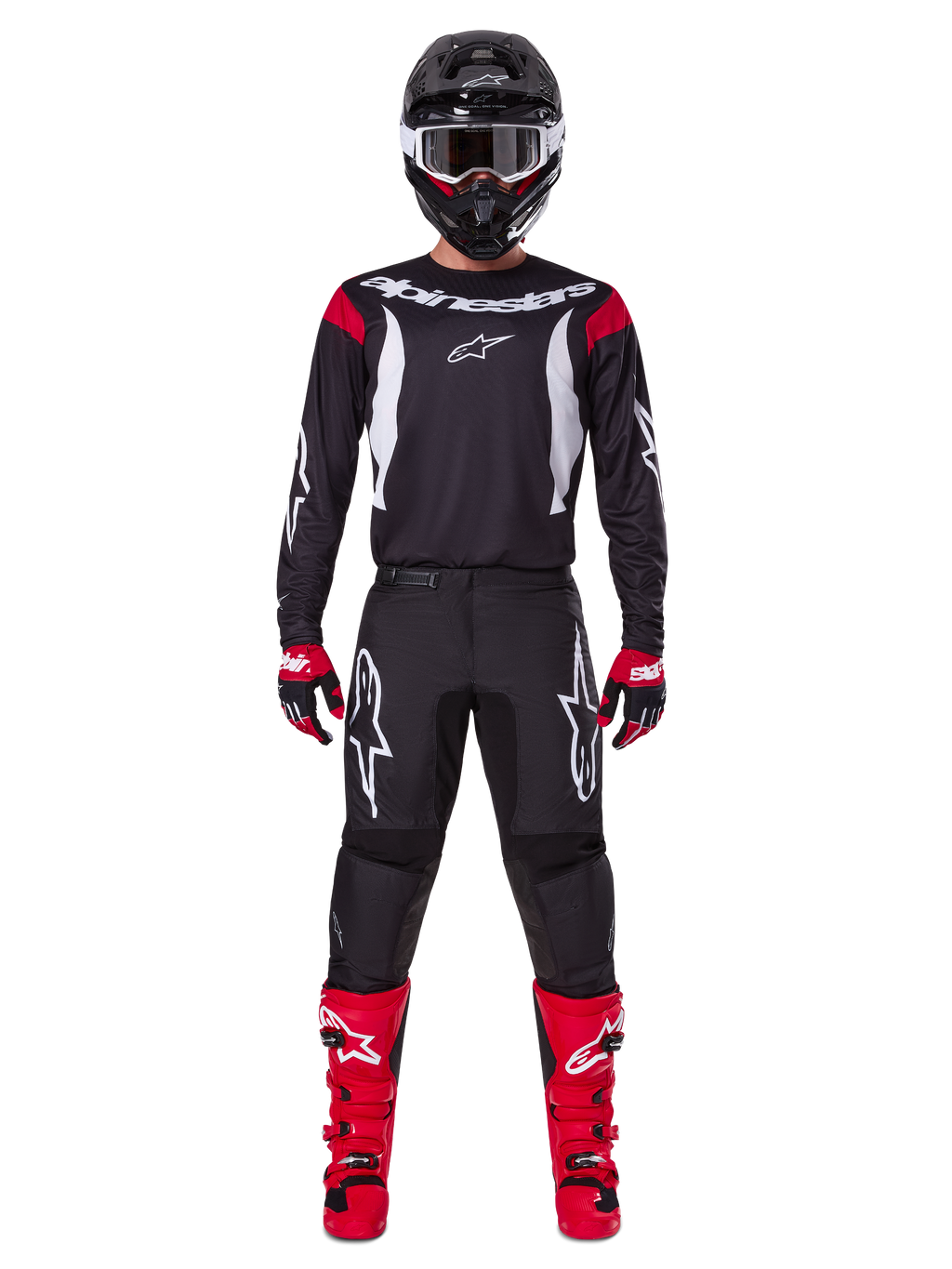 Alpinestars 2025 Fluid Haul Gear Set, pilota di motocross in abbigliamento completo, maglia nera con dettagli rossi sulle spalle e loghi bianchi, pantaloni neri con logo a stella bianco, stivali rosso acceso, guanti rossi e neri, casco nero con occhiali bianchi, look coordinato per prestazioni off-road
