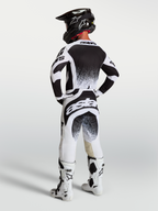 Alpinestars Pantaloni Techstar Swan, pantaloni da motocross da uomo, bianchi e neri, vista posteriore, vestibilità atletica.