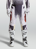 Alpinestars Pantaloni Techstar Swan, pantaloni da motocross lilla chiaro e grigio scuro con accenti rossi e fibbia magnetica.