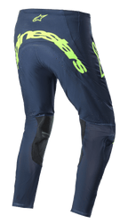 Alpinestars 2023 Supertech Bruin Pants, pantaloni da motocross, Night Navy e Giallo Fluo, vista posteriore con grande logo Alpinestars giallo fluorescente sulla seduta, zone di ventilazione traforate e rinforzi neri all'interno della gamba.