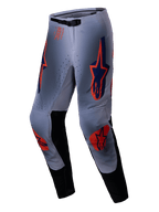 Alpinestars pantaloni Supertech Lipan 2025, pantaloni da motocross, grigio e arancione fluo, caratterizzati da vivaci loghi a stella arancioni e blu navy su cosce e ginocchia, pannelli interni neri e cintura regolabile, progettati per prestazioni off-road di livello professionale