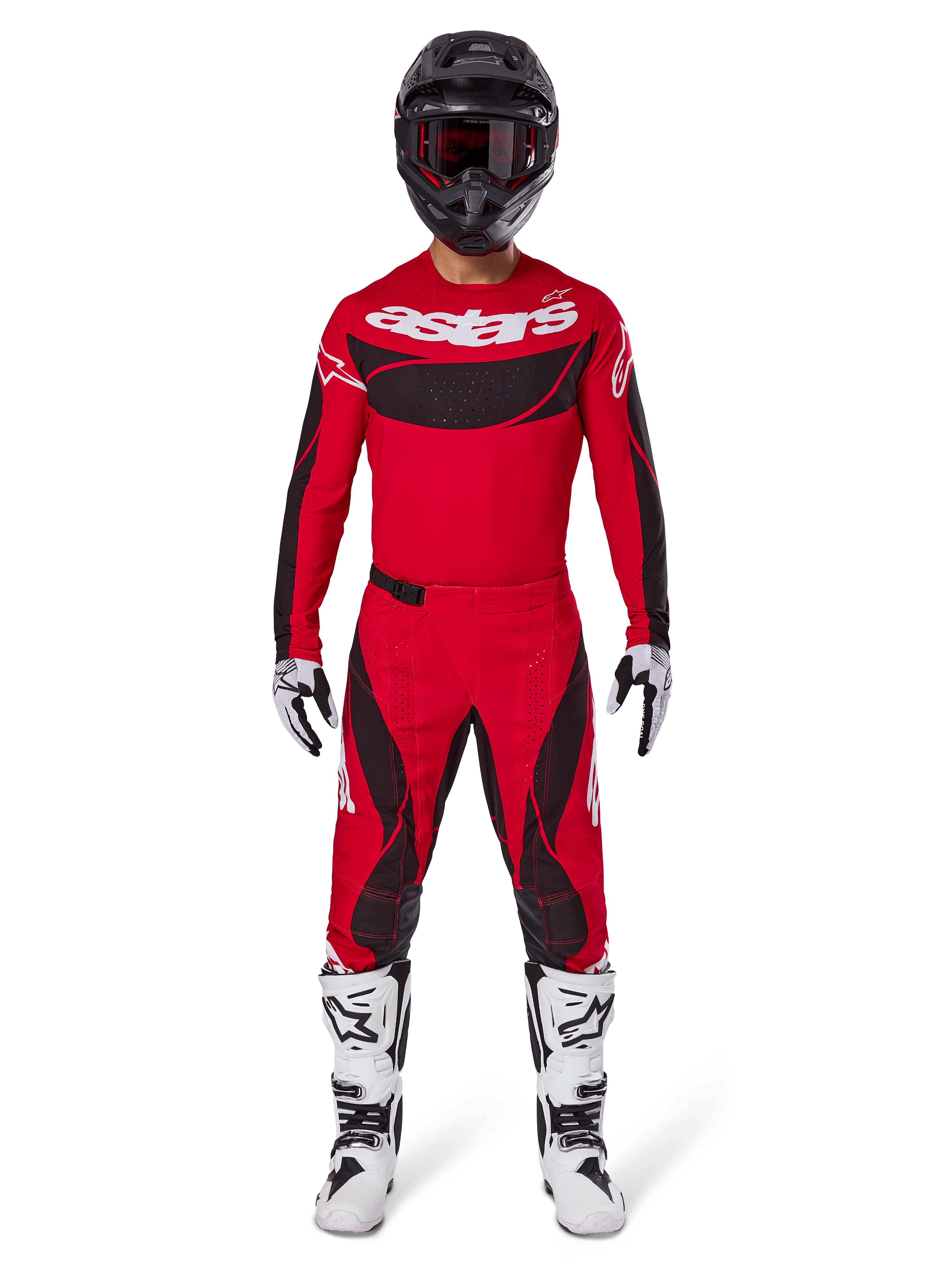 Alpinestars 2025 Techstar Dreem Pants, pantaloni da motocross, rosso acceso e nero, indossati come parte di un set completo da gara con maglia rossa coordinata, casco nero e stivali bianchi, design sportivo con loghi evidenti per prestazioni fuoristrada.