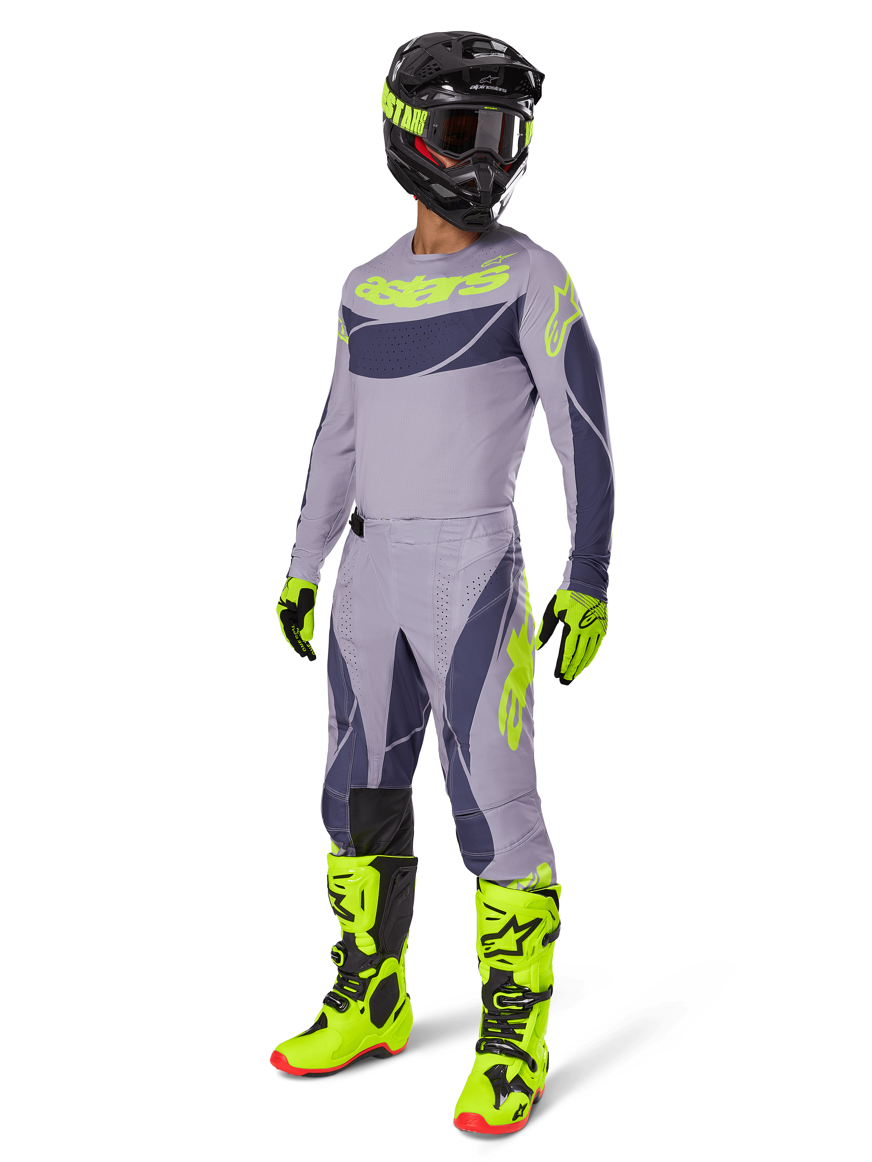 Alpinestars 2025 Techstar Dreem Pants, pantaloni da motocross, grigio e grigio scuro con accenti verde neon, indossati con maglia coordinata, stivali verde neon brillante e casco nero, set completo di abbigliamento professionale da motocross