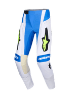Alpinestars Pantaloni Techstar Knif 2026, pantaloni da motocross, blu Ucla, bianco e giallo fluo, grande logo a stella nero con accenti giallo fluorescente, marchio astars sulle ginocchia, pannelli traforati per la ventilazione, design sportivo per corse fuoristrada