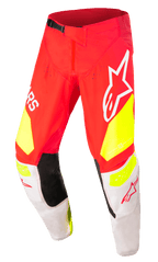 Alpinestars Techstar Factory Pants, pantaloni da motocross, rossi con accenti giallo fluo e bianchi, dotati di pannelli interni neri alle ginocchia, grandi loghi Alpinestars, fori di ventilazione e fibbia nera regolabile in vita