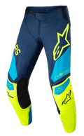 Alpinestars Techstar Factory Pants, pantaloni da motocross, blu scuro, giallo fluo e azzurro, con pannelli interni neri sulle ginocchia, logo stella gialla sulla coscia, scritta "ONE GOAL ONE VISION" e zone di ventilazione traforate per abbigliamento fuoristrada ad alte prestazioni