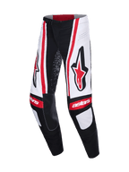 Alpinestars Techstar Nomur Pants 2026, pantaloni da motocross, nero, bianco e rosso, con grandi loghi Astars rossi sulle cosce, pannelli bianchi con strisce verticali rosse e marchio "astars" sulle ginocchia.