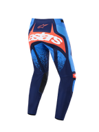 Alpinestars Techstar Nomur Pants 2026, pantaloni da motocross, blu scuro, arancione e azzurro UCLA, vista posteriore con logo Astars bianco su pannello arancione, design multi-pannello con accenti azzurri, pannelli interni neri sulle ginocchia, abbigliamento resistente per fuoristrada.