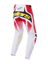 Alpinestars Pantaloni Techstar Nomur 2026, pantaloni da motocross, bianco, rosso e nero, vista posteriore con marchio 'Stars' giallo e grafiche puntinate rosse, costruzione multi-pannello resistente per gare off-road
