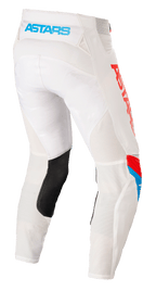 Pantaloni Alpinestars Techstar Quadro, pantaloni da motocross, bianco sporco, blu neon e rosso vivace, vista posteriore con logo 'ASTARS' azzurro sulla fascia in vita, pannelli di ventilazione in mesh, inserto in pelle nera sull'interno gamba e logo rosso vivace sul lato