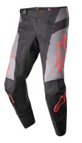 Alpinestars Pantaloni Techstar Sein 2023, pantaloni da gara motocross, nero e grigio con grafiche a stella rosso neon, con zone di ventilazione traforate, fibbia magnetica in vita e costruzione del ginocchio 3D Babel rinforzata per prestazioni off-road.