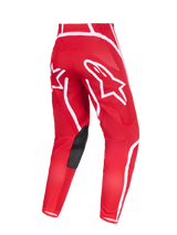 Alpinestars 2026 Fluid Apex Pants, pantaloni da motocross, rosso e bianco, vista posteriore con grandi loghi a stella bianchi sulla seduta, inserti interni alle ginocchia in pelle sintetica nera, design ergonomico pre-curvato per guida off-road