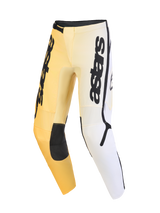 Alpinestars 2026 Fluid Apex Pants, pantaloni da motocross, giallo, bianco e nero, con design sfumato, logo astars verticale sulle cosce, pannelli rinforzati neri sulle ginocchia e design ergonomico pre-curvato per prestazioni off-road.