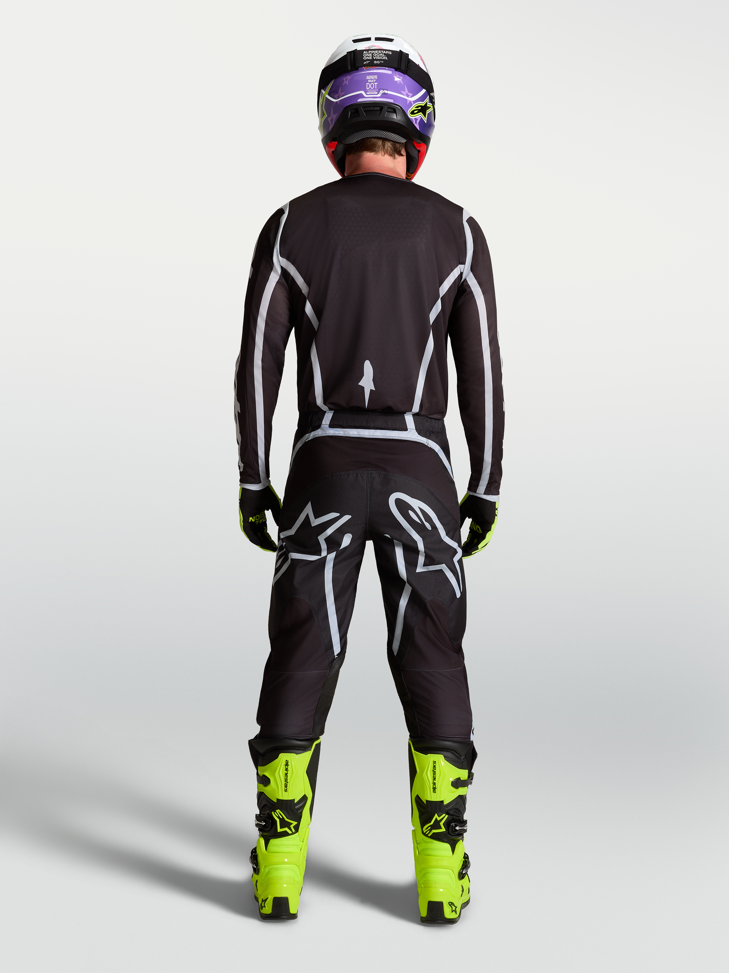 Alpinestars pantaloni Fluid Apex V2, pantaloni motocross uomo neri e argento, vista posteriore, vestibilità sportiva.