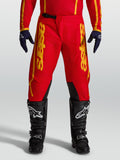 Alpinestars Pantaloni Fluid Apex V2, pantaloni motocross da uomo, rosso e oro, con rinforzi resistenti e taglio ergonomico.