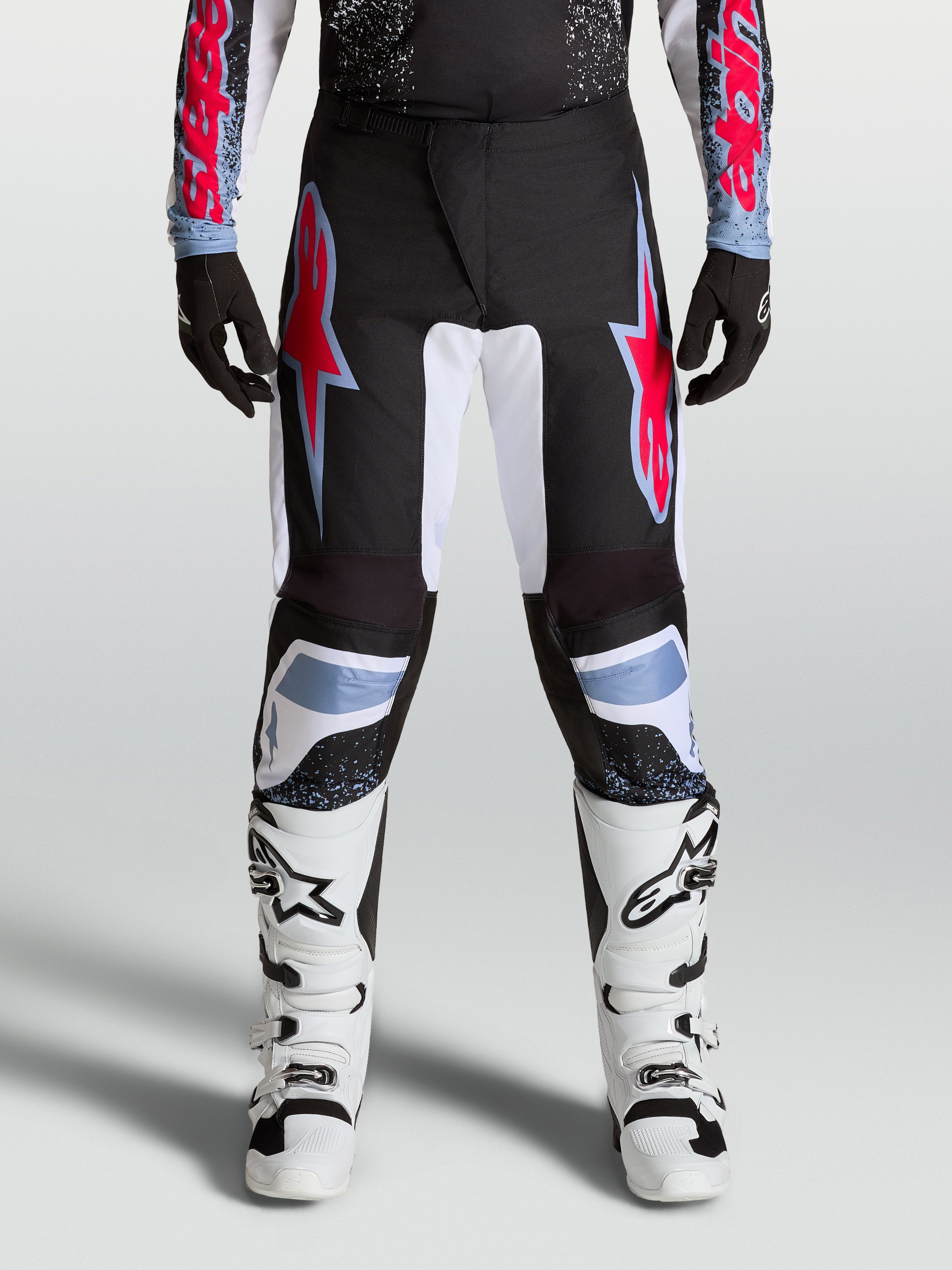 Alpinestars pantaloni Fluid Drag, pantaloni motocross da uomo neri e rossi, in resistente politessuto 600D rinforzato.