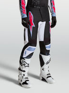 Alpinestars pantaloni Fluid Drag, pantaloni da motocross per uomo neri e bianchi con accenti rosso fluo e azzurro, per guida off-road.