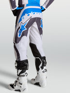 Alpinestars pantaloni Fluid Drag da uomo grigi e blu, vista posteriore con costruzione ergonomica 3D.