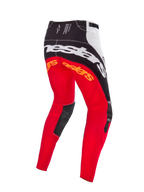 Alpinestars Limited Edition Techstar Deep Pants, pantaloni da motocross, colorazione Black White High Red, vista posteriore con grande marchio Alpinestars bianco sulla seduta, loghi arancioni sulla parte superiore delle gambe e pannelli interni del ginocchio in pelle nera, progettati per il racing fuoristrada professionale