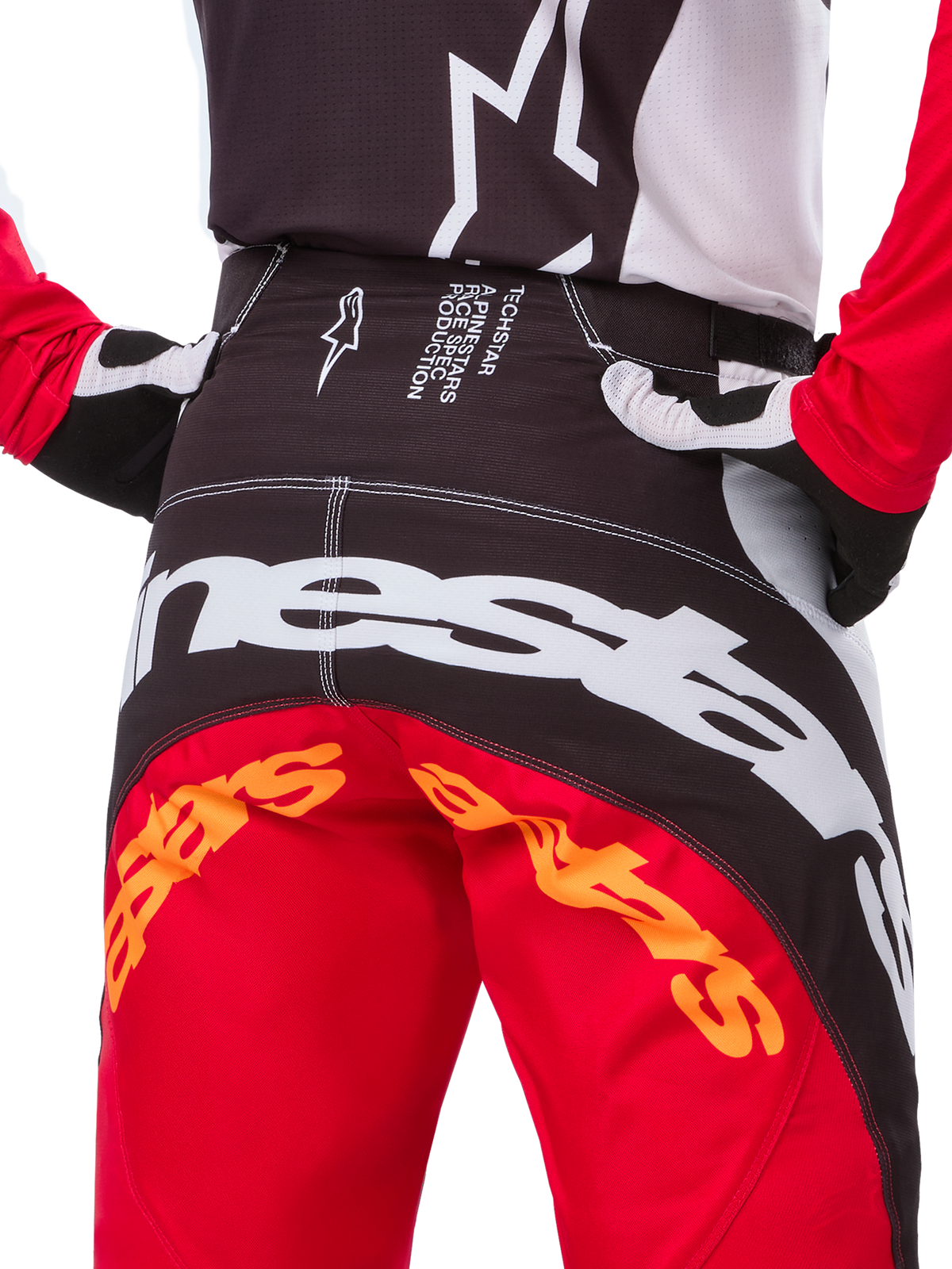 Alpinestars Limited Edition Techstar Deep Pants, pantaloni da motocross, nero, bianco e rosso acceso, con design multi-pannello, ginocchia rinforzate e pannelli elasticizzati a 4 vie per prestazioni fuoristrada.