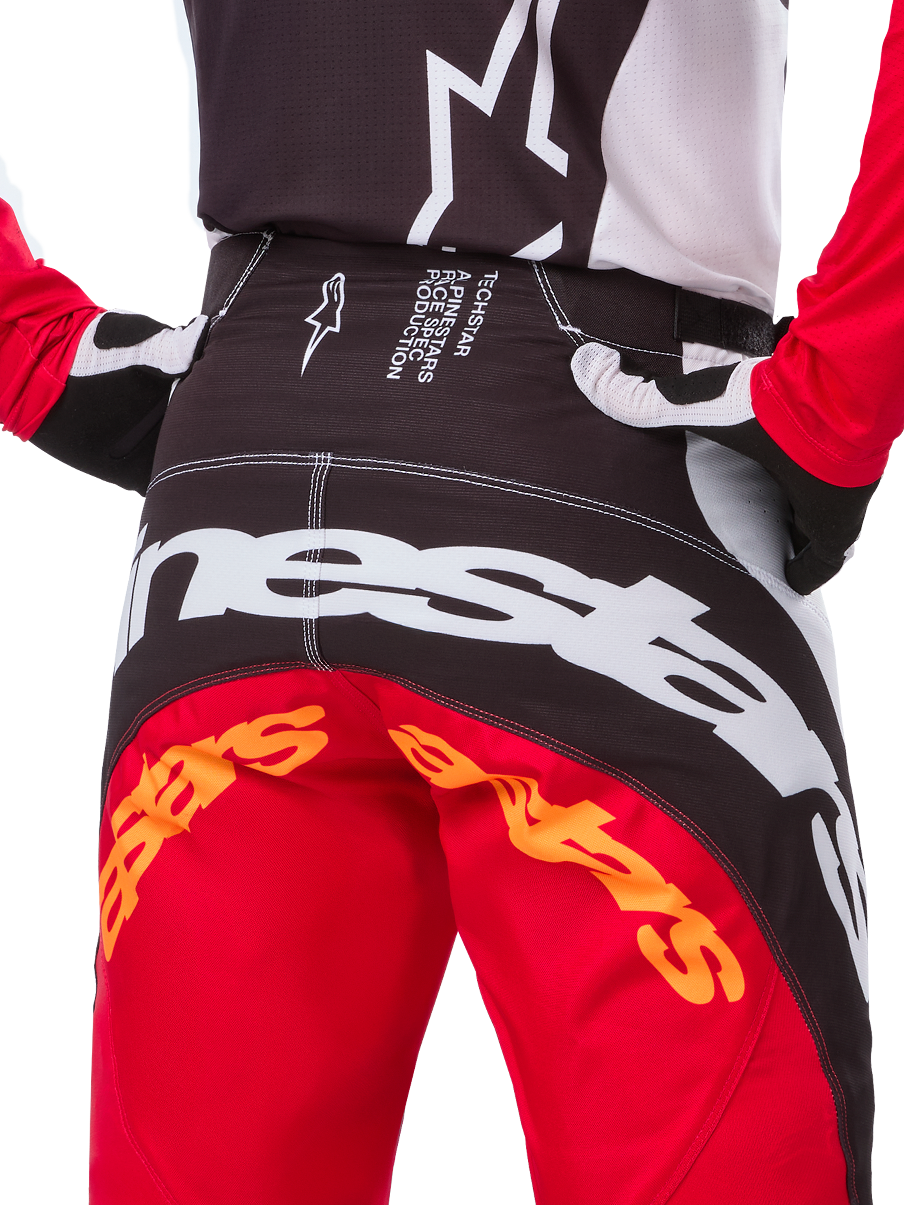 Alpinestars Limited Edition Techstar Deep Pants, pantaloni da motocross, nero, bianco e rosso acceso, con design multi-pannello, ginocchia rinforzate e pannelli elasticizzati a 4 vie per prestazioni fuoristrada.