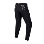 Alpinestars Techdura Pants, pantaloni da enduro e off-road neri, vista posteriore con loghi a stella grigi sui fianchi, marchio giallo sulla fascia in vita posteriore, robusto materiale in poliammide elasticizzata con design resistente per la guida in moto