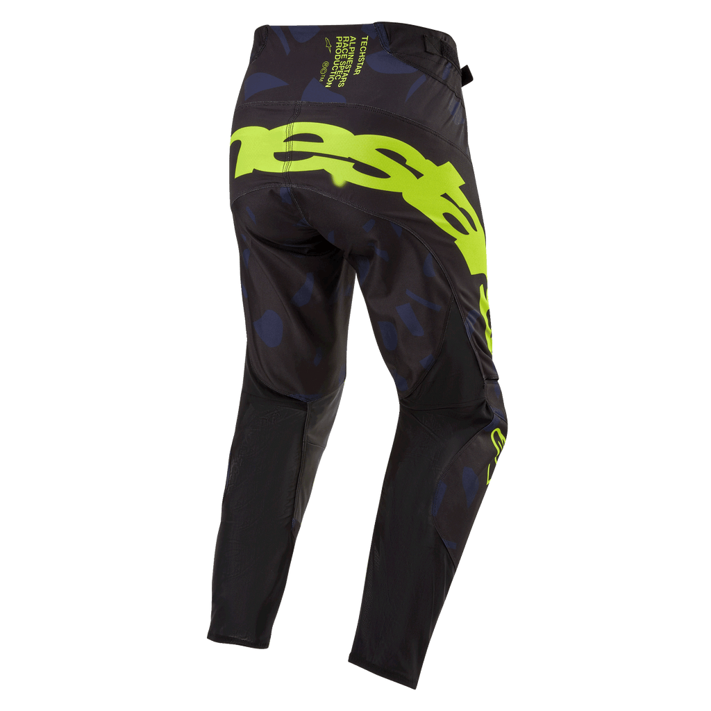 Alpinestars Pantaloni Techstar Rantera 2024, pantaloni da motocross, nero, blu navy e giallo fluo, vista posteriore con logo giallo fluo sulla seduta, pannelli blu navy e tessuto tecnico nero per corse fuoristrada