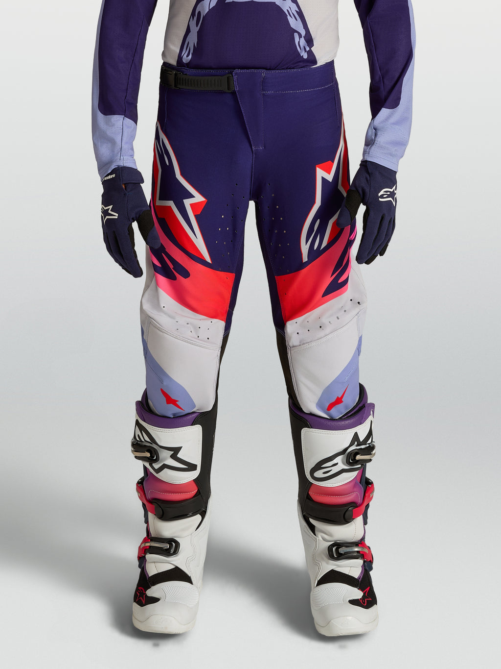 Alpinestars Pantaloni Supertech Dyna Ragazzo, modello da motocross viola e rosa fluo in tessuto rip-stop elasticizzato.