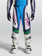 Alpinestars pantaloni Supertech Maven ragazzo, pantaloni motocross bianchi e blu, accenti verde fluo, vestibilità atletica.