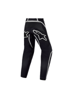 Alpinestars Pantaloni Fluid Apex V2 Ragazzo, pantaloni da motocross per ragazzi, neri e argento, vista posteriore con costruzione ergonomica e grande logo a stella, abbigliamento tecnico da fuoristrada