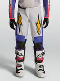 Alpinestars pantaloni Fluid Drag ragazzo, bianchi e blu con grafiche oro e vestibilità ergonomica per corse off-road.