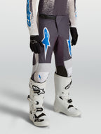 Alpinestars Pantaloni Fluid Drag Ragazzo, pantaloni da motocross grigio, blu e bianco, in poliestere 600D, per fuoristrada.