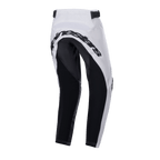 Alpinestars pantaloni Youth Racer Lucent 2024, pantaloni da motocross, bianco e nero, vista posteriore con ampi pannelli neri rinforzati sulla seduta e all'interno delle gambe, scritta Alpinestars sul retro e cinturini regolabili in vita per la guida fuoristrada