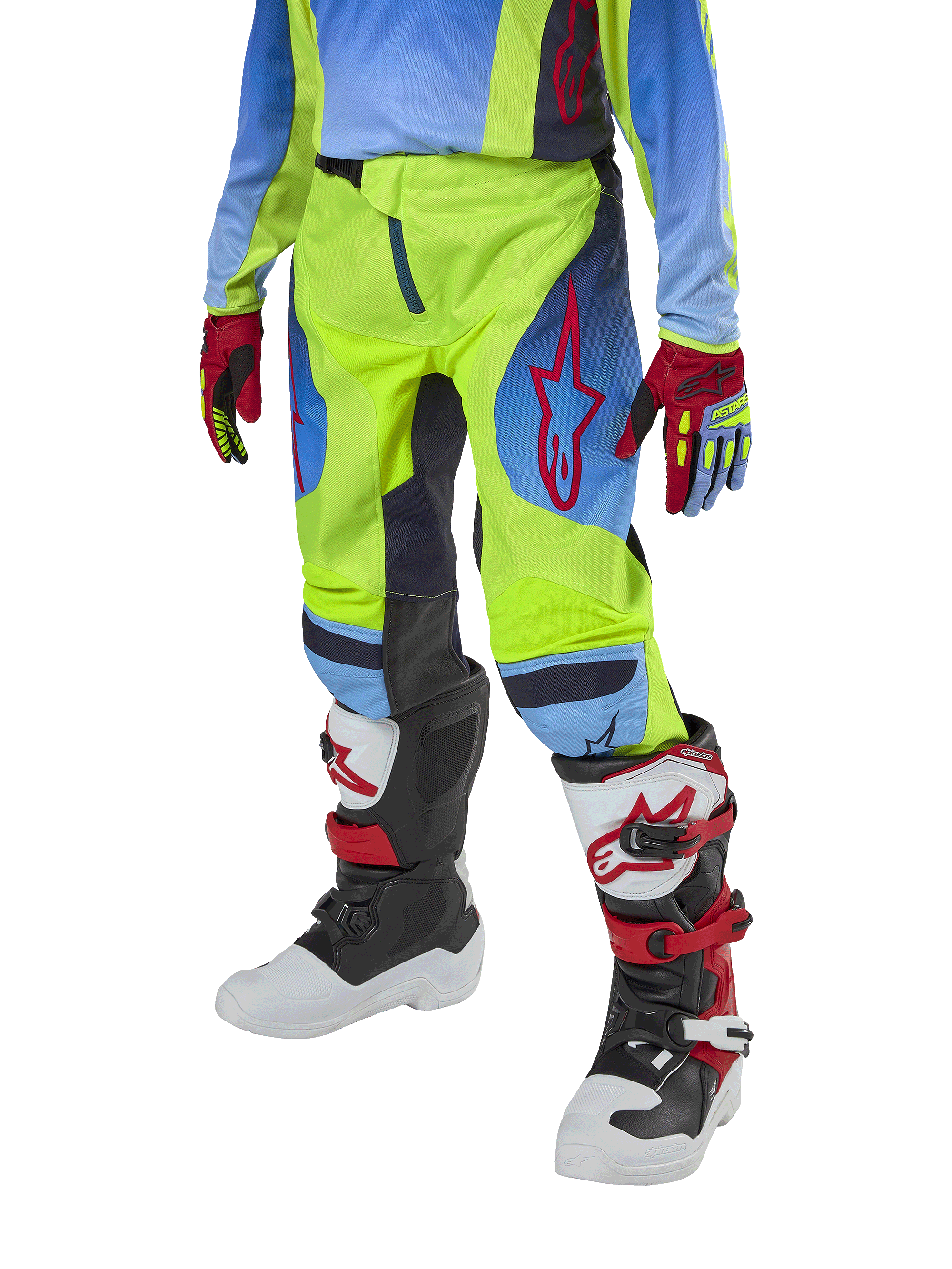 Pantaloni Alpinestars Youth 2024 Racer Hoen, pantaloni da motocross, giallo fluo e blu notte con dettagli rossi, indossati con guanti coordinati e stivali bianchi, neri e rossi, con vestibilità sportiva e gambe pre-curvate per il fuoristrada