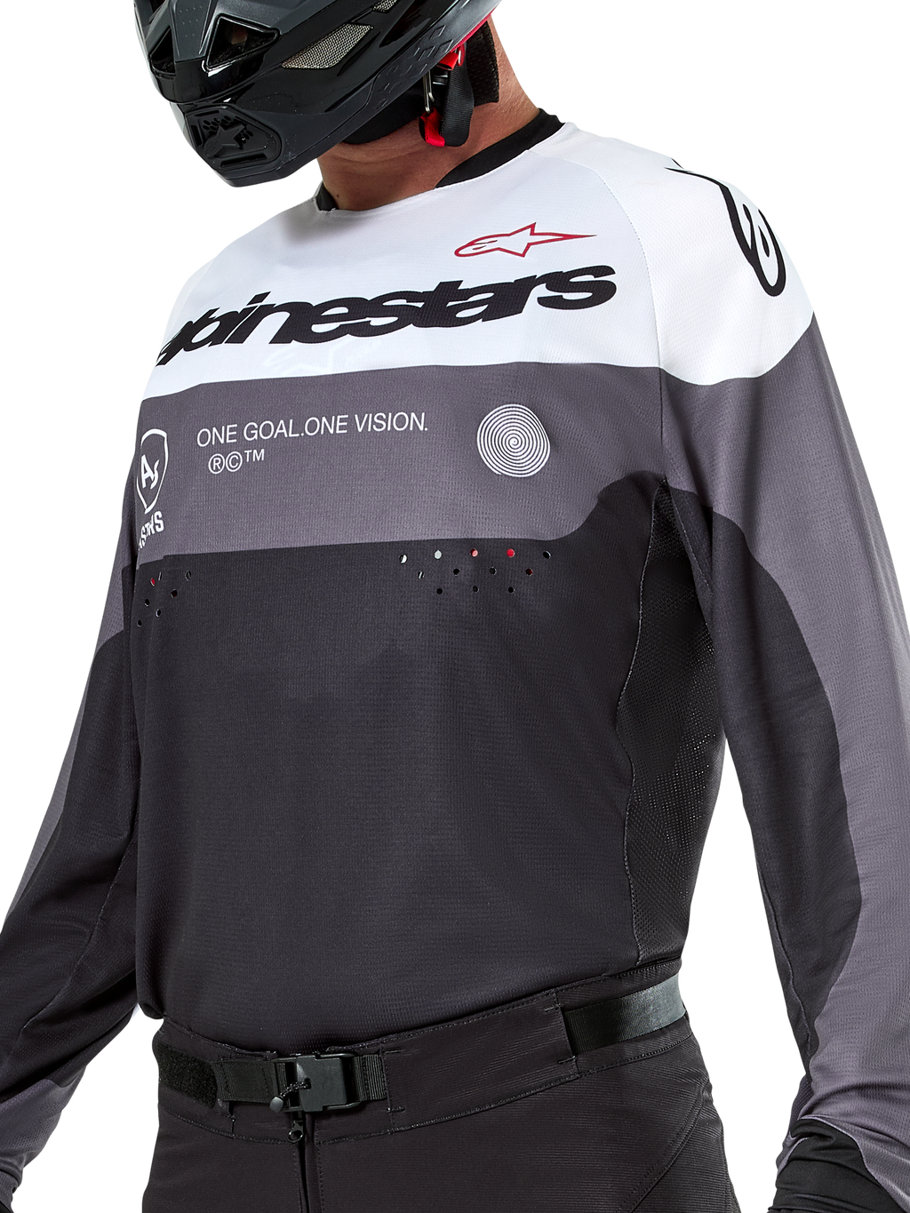 Maglia Alpinestars Pro-Dura, maglia da motocross ed enduro, nero, grigio magnet e bianco, abbigliamento tecnico off-road con perforazioni tagliate al laser e costruzione in tessuto poliestere traspirante.