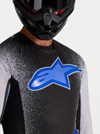Alpinestars Maglia Supertech Hiten AFD, maglia motocross da uomo, nera e blu, con ventilazione laser-cut e logo a stella.