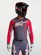 Alpinestars Maglia Supertech Hiten AFD, maglia da motocross da uomo, grigio e rosso fluo, in mesh ventilata con perforazioni laser per prestazioni off-road.