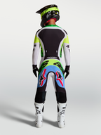 Alpinestars maglia Supertech Dyna 2027 e gear set, completo motocross uomo, verde fluo e nero, vista posteriore, mesh elasticizzato.