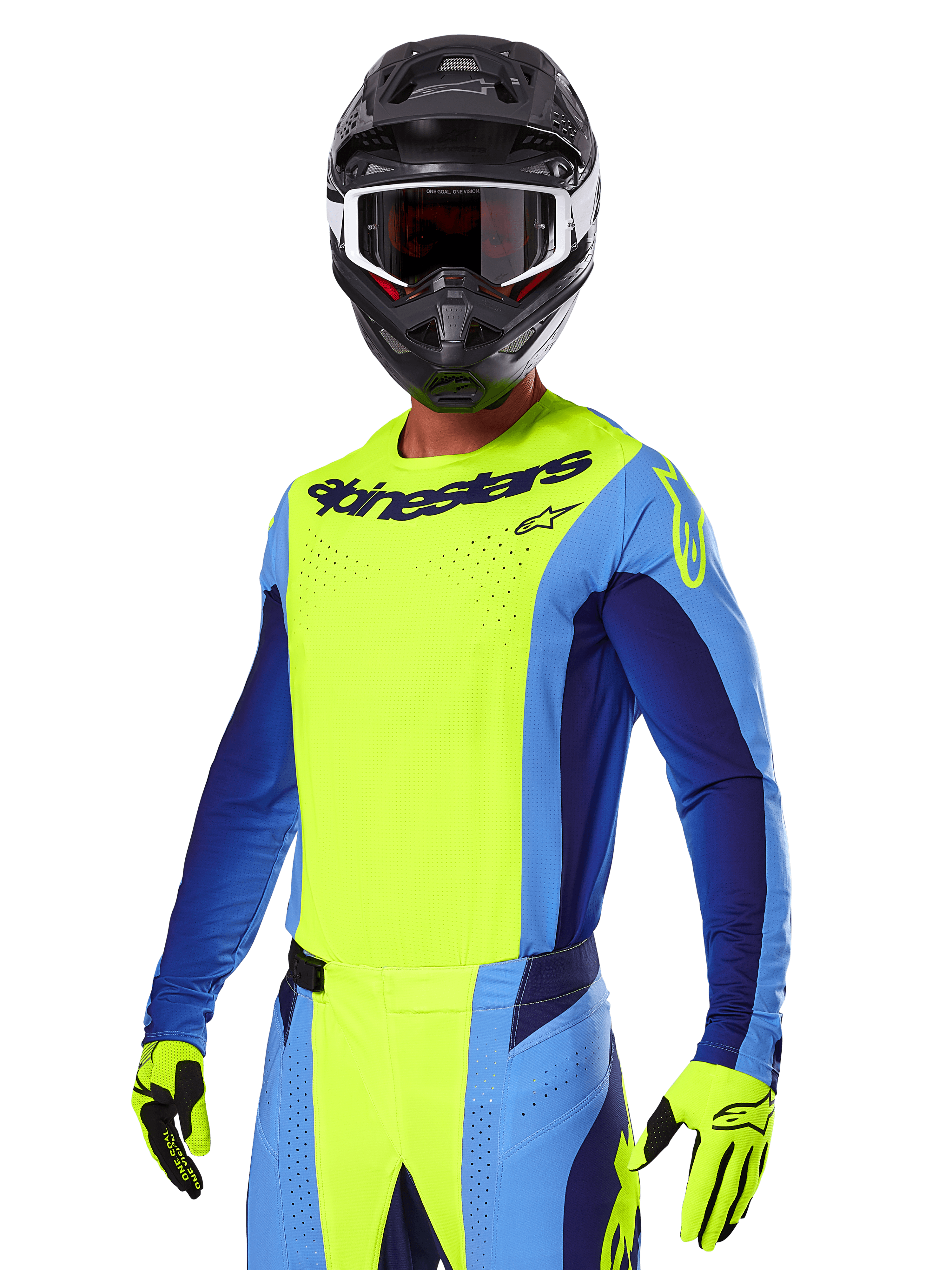 Set Gear Alpinestars Techstar Melt 2025, pilota di motocross con maglia giallo brillante e blu e pantaloni coordinati, casco nero con occhiali bianchi e neri, guanti gialli, abbigliamento da corsa off-road con logo Alpinestars e dettagli traforati